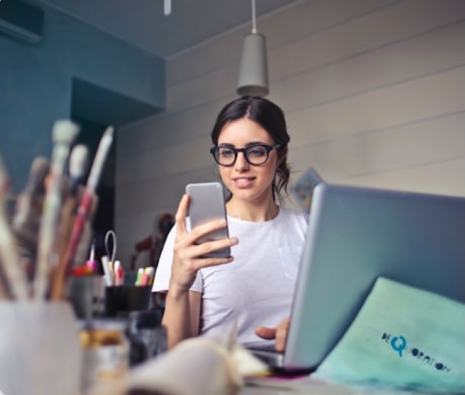 A female holding her phone