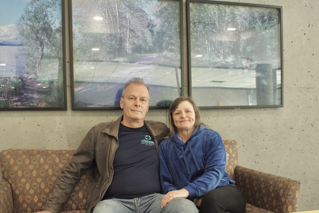 Dean and Terry Lee seated on a couch