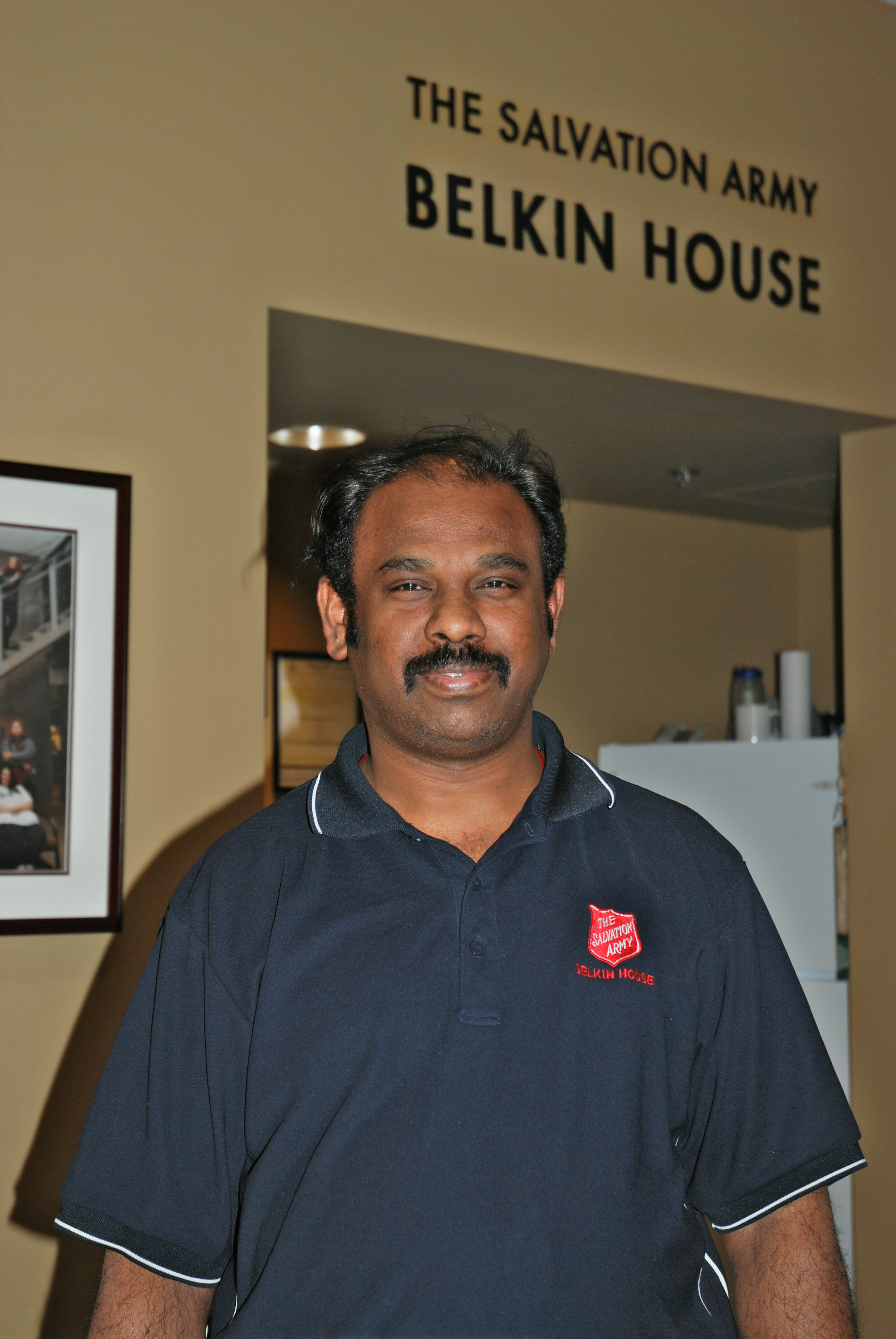 An employee smiling at the camera